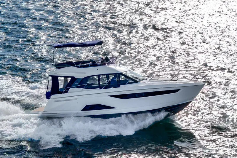  Yacht Photos Pics 2024 Bavaria R40 yacht cruising on shimmering water.