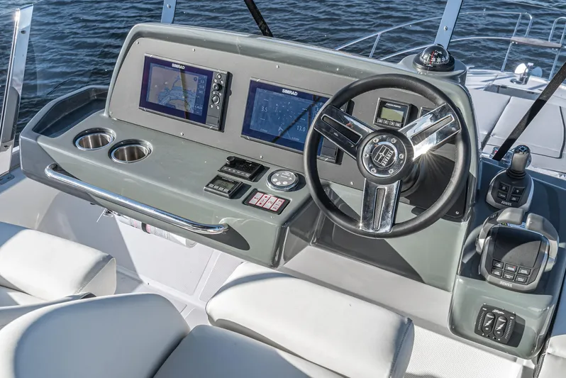  Yacht Photos Pics 2024 Bavaria R40 yacht helm with modern navigation displays and steering wheel.