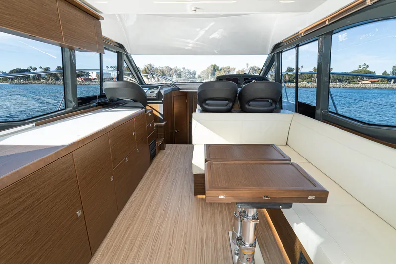  Yacht Photos Pics Luxurious interior of 2024 Bavaria R40 yacht with modern seating and panoramic windows.