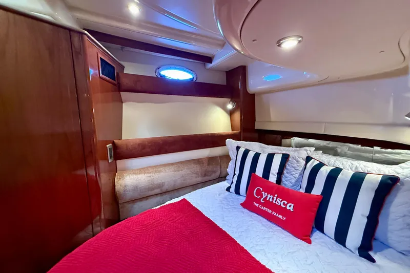 Cynisca Yacht Photos Pics Luxurious cabin interior of 2006 Meridian 391 Sedan yacht with striped pillows.