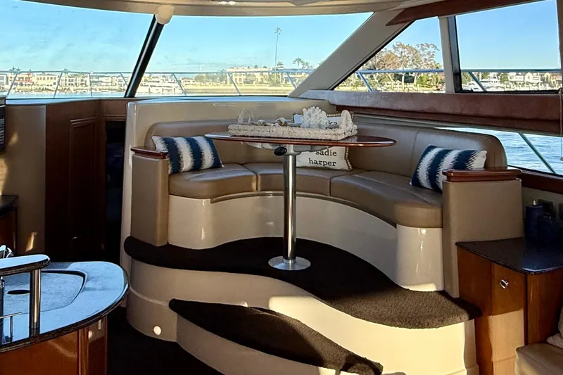 Cynisca Yacht Photos Pics Luxurious interior of a 2006 Meridian 391 Sedan yacht with elegant seating and panoramic windows.