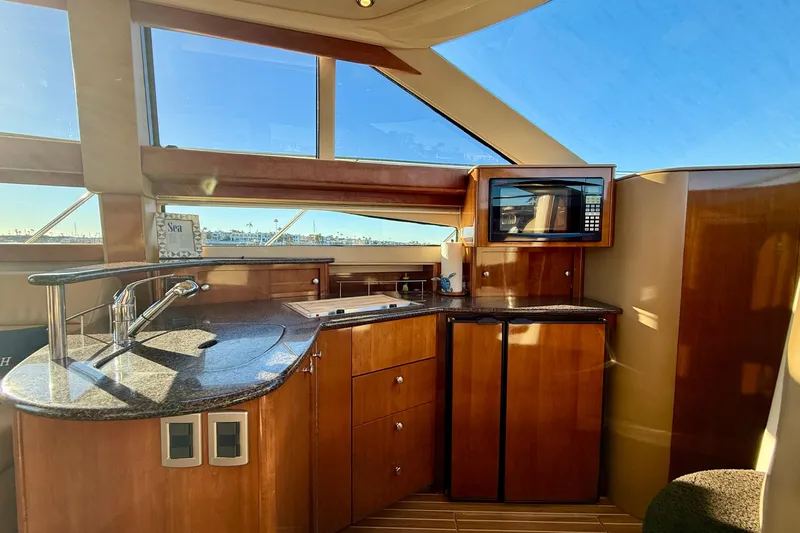 Cynisca Yacht Photos Pics Luxurious 2006 Meridian 391 Sedan yacht interior with modern kitchen amenities.