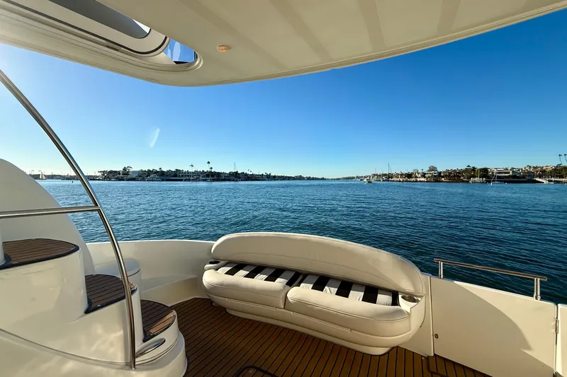 Cynisca Yacht Photos Pics Luxury 2006 Meridian 391 Sedan yacht with scenic ocean view and elegant deck seating.