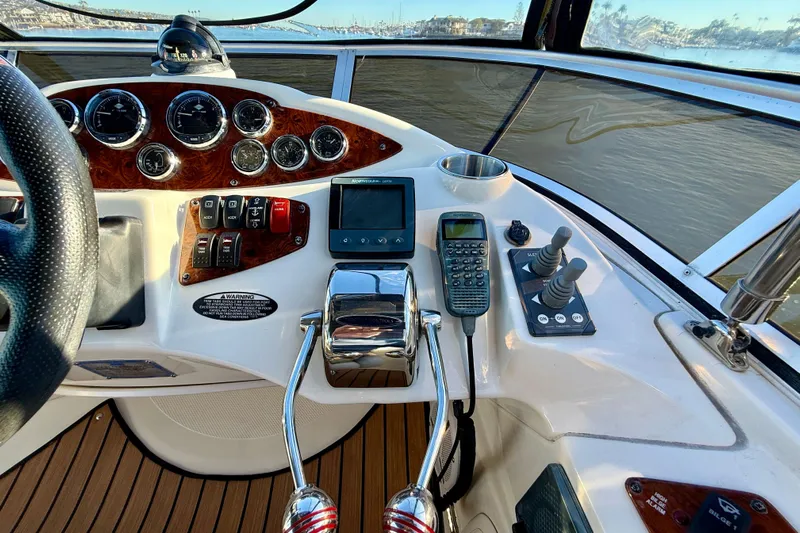 Cynisca Yacht Photos Pics Control panel of a 2006 Meridian 391 Sedan yacht with navigation instruments.