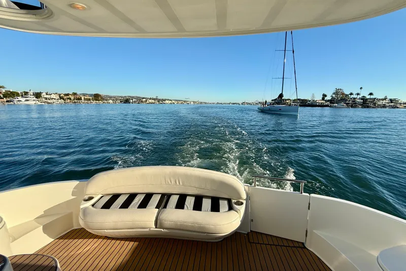 Cynisca Yacht Photos Pics 2006 Meridian 391 Sedan cruising on a sunny day, with scenic waterfront views.