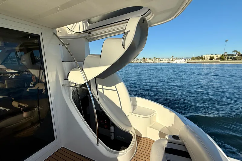 Cynisca Yacht Photos Pics 2006 Meridian 391 Sedan yacht with spiral staircase, docked by calm waters.