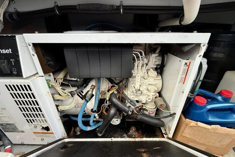 Cynisca Yacht Photos Pics Engine compartment of a 2006 Meridian 391 Sedan, showcasing mechanical components and wiring.