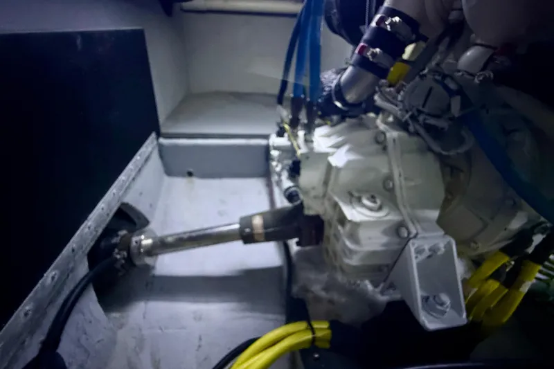 Cynisca Yacht Photos Pics Engine compartment of a 2006 Meridian 391 Sedan boat, featuring mechanical components and wiring.