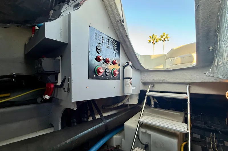 Cynisca Yacht Photos Pics Engine room of 2006 Meridian 391 Sedan with control panel and ladder.