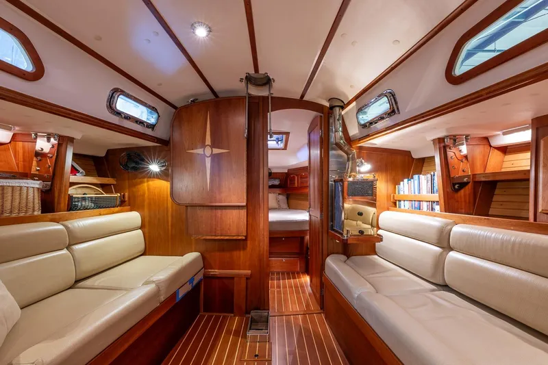 September Song Yacht Photos Pics Luxurious interior of 2007 Sabre 386 sailboat with wood finish and comfortable seating.