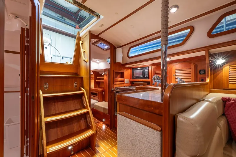 September Song Yacht Photos Pics Luxurious interior of 2007 Sabre 386 yacht with wooden finishes and modern amenities.