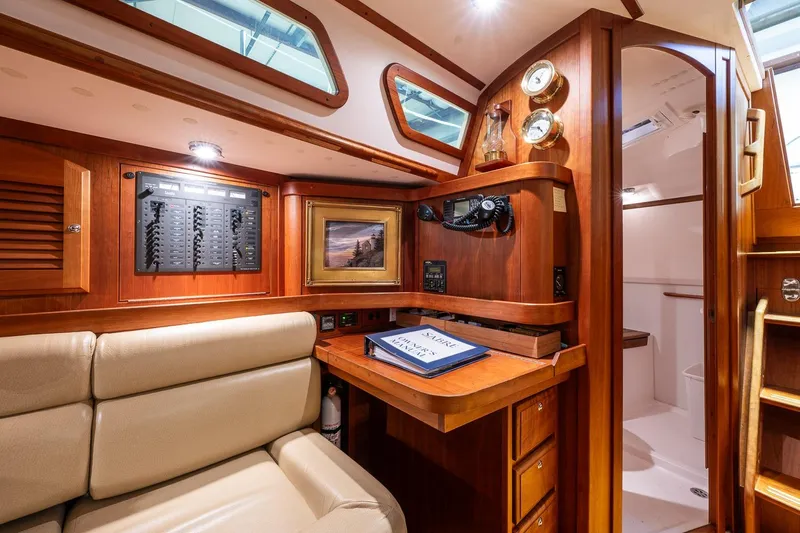 September Song Yacht Photos Pics Luxurious 2007 Sabre 386 yacht interior with navigation station and elegant wood finish.