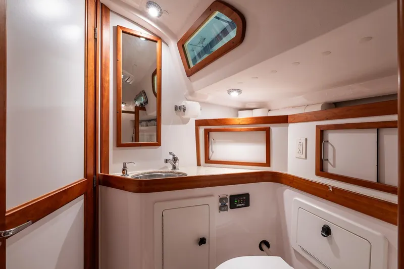 September Song Yacht Photos Pics 2007 Sabre 386 yacht bathroom with wooden accents and modern fixtures.
