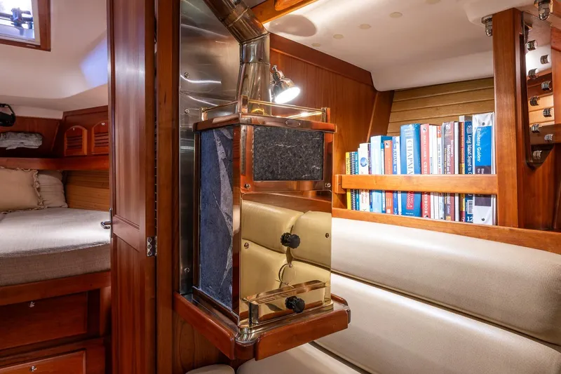 September Song Yacht Photos Pics Cozy Sabre 386 yacht interior with bookshelf and seating, 2007 model.