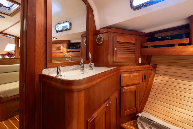 September Song Yacht Photos Pics Luxurious 2007 Sabre 386 yacht interior with wooden cabinetry and modern fixtures.