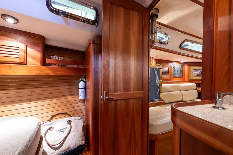 September Song Yacht Photos Pics Luxurious 2007 Sabre 386 yacht interior with wood finish and cozy seating area.