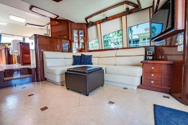 My Reality Yacht Photos Pics Luxurious interior of 2012 Neptunus 62 Flybridge yacht with elegant seating and modern decor.