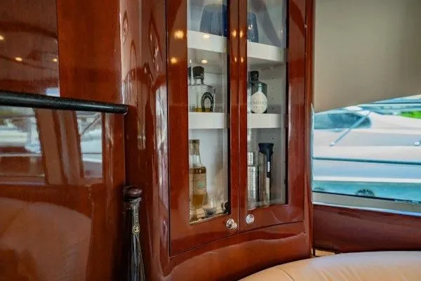 My Reality Yacht Photos Pics Luxurious interior of 2012 Neptunus 62 Flybridge yacht with elegant wooden cabinetry.