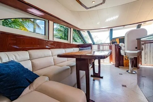 My Reality Yacht Photos Pics Luxurious interior of 2012 Neptunus 62 Flybridge yacht with plush seating and elegant design.