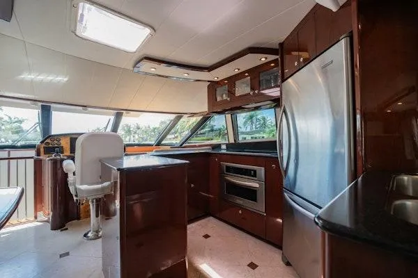 My Reality Yacht Photos Pics Luxurious interior of 2012 Neptunus 62 Flybridge yacht with modern kitchen amenities.