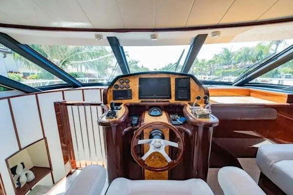 My Reality Yacht Photos Pics Luxurious 2012 Neptunus 62 Flybridge yacht interior with modern helm and panoramic windows.