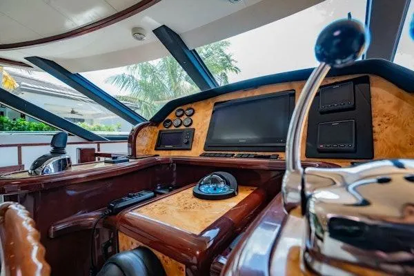 My Reality Yacht Photos Pics Luxurious helm of 2012 Neptunus 62 Flybridge yacht with advanced navigation controls.