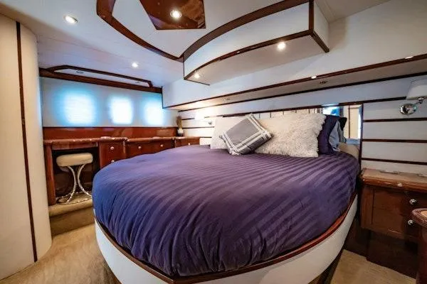 My Reality Yacht Photos Pics Luxurious bedroom interior of 2012 Neptunus 62 Flybridge yacht with plush bedding.