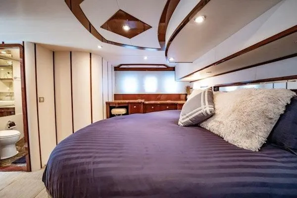 My Reality Yacht Photos Pics Luxurious bedroom interior of 2012 Neptunus 62 Flybridge yacht with plush bedding.
