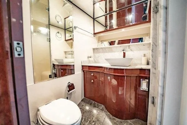 My Reality Yacht Photos Pics Luxurious bathroom in 2012 Neptunus 62 Flybridge yacht with elegant wood cabinetry.