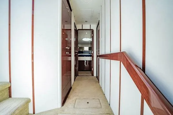 My Reality Yacht Photos Pics Luxurious interior hallway of 2012 Neptunus 62 Flybridge yacht with elegant wood accents.