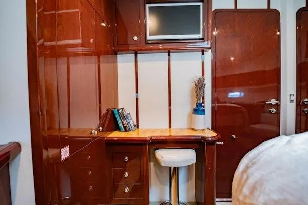 My Reality Yacht Photos Pics Luxurious Neptunus 62 Flybridge 2012 yacht interior with elegant wood finish and desk area.