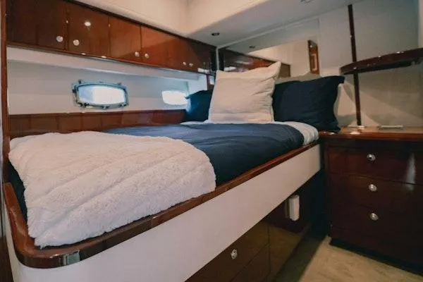 My Reality Yacht Photos Pics Luxurious cabin interior of 2012 Neptunus 62 Flybridge yacht with cozy bedding.