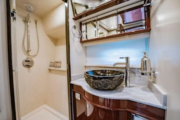 My Reality Yacht Photos Pics Luxurious bathroom in 2012 Neptunus 62 Flybridge yacht with modern fixtures and elegant design.