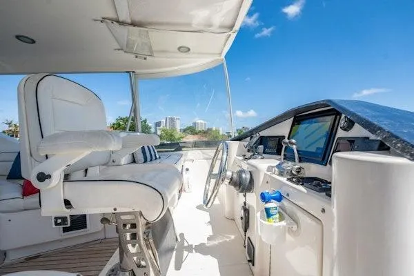 My Reality Yacht Photos Pics Flybridge of 2012 Neptunus 62 yacht with steering wheel and navigation equipment.