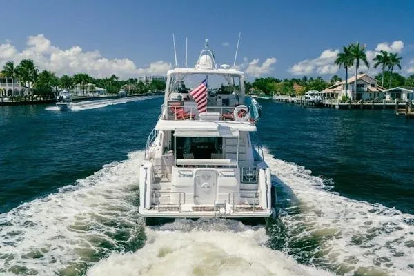 My Reality Yacht Photos Pics Luxurious 2012 Neptunus 62 Flybridge yacht cruising on a sunny day.