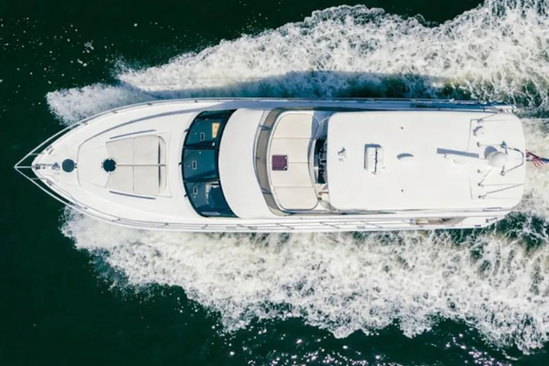 My Reality Yacht Photos Pics Top view of 2012 Neptunus 62 Flybridge yacht cruising on water.