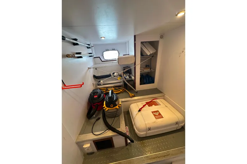 My Reality Yacht Photos Pics Storage area in 2012 Neptunus 62 Flybridge yacht with equipment and supplies.