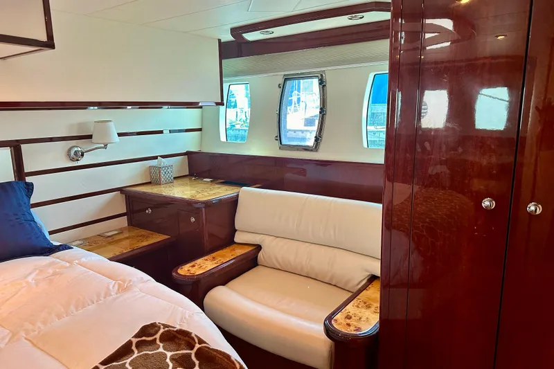 My Reality Yacht Photos Pics Luxurious cabin interior of 2012 Neptunus 62 Flybridge yacht with elegant wood finishes.