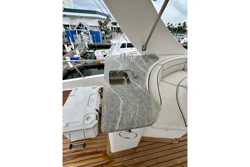 My Reality Yacht Photos Pics Luxurious 2012 Neptunus 62 Flybridge yacht with granite countertop and plush seating.