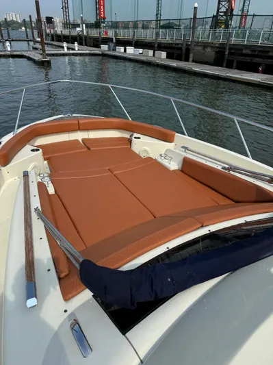 Ufo Yacht Photos Pics 2018 Chris-Craft Launch 38 boat with tan seating, docked by a marina.