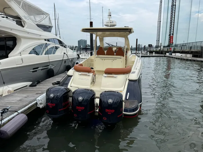 Ufo Yacht Photos Pics 2018 Chris-Craft Launch 38 boat docked with four powerful outboard engines.