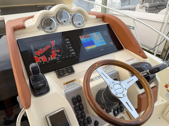 Ufo Yacht Photos Pics 2018 Chris-Craft Launch 38 dashboard with navigation screens and steering wheel.