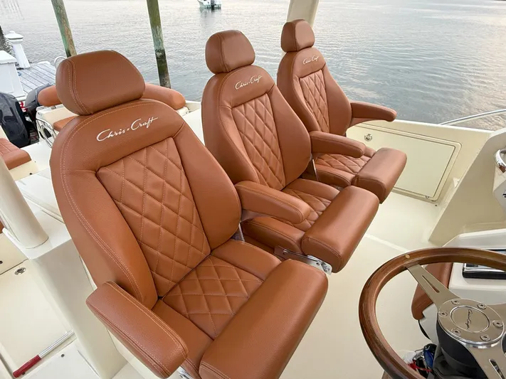 Ufo Yacht Photos Pics Luxurious leather seats on 2018 Chris-Craft Launch 38 boat, featuring elegant design and craftsmanship.