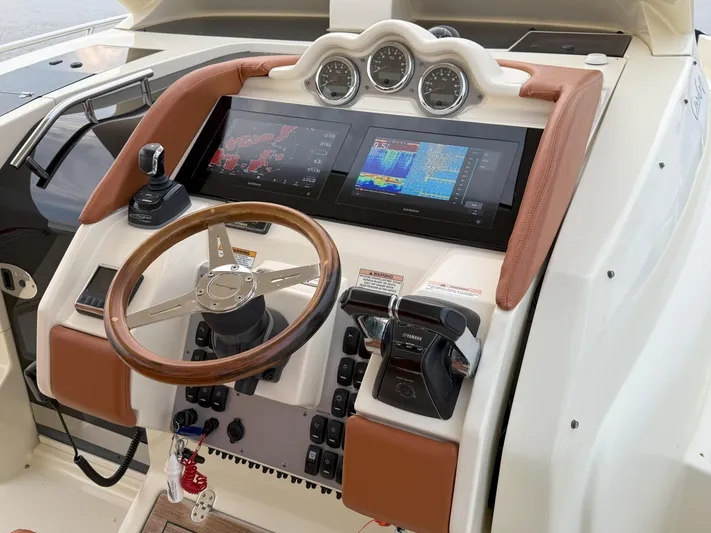 Ufo Yacht Photos Pics 2018 Chris-Craft Launch 38 helm with advanced navigation displays and controls.