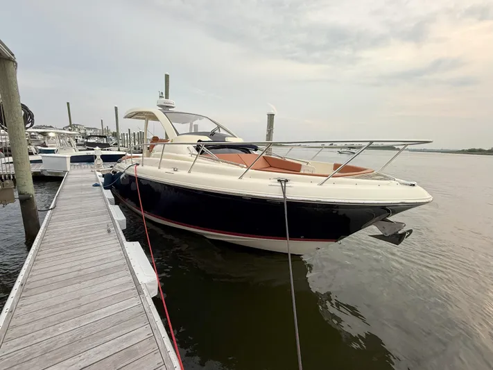 Ufo Yacht Photos Pics 2018 Chris-Craft Launch 38 docked at marina, sleek design, luxury motorboat.