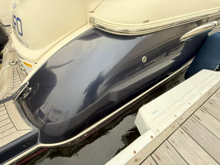 Ufo Yacht Photos Pics 2018 Chris-Craft Launch 38 boat docked, showcasing sleek hull design and elegant detailing.