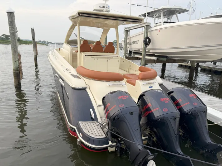 Ufo Yacht Photos Pics 2018 Chris-Craft Launch 38 with triple outboard engines docked at marina.