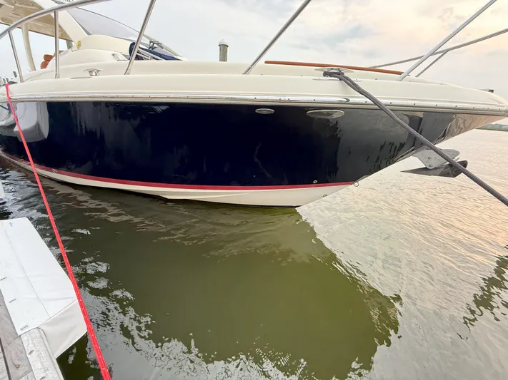 Ufo Yacht Photos Pics 2018 Chris-Craft Launch 38 boat docked on calm water.