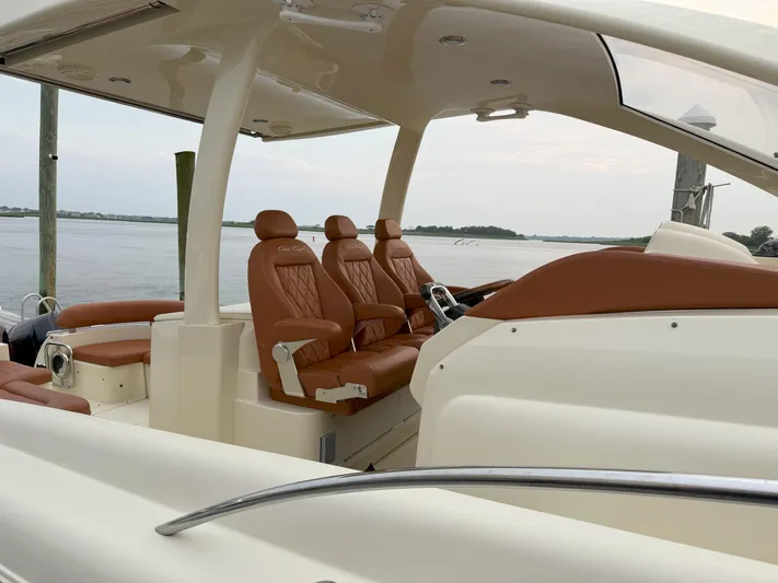 Ufo Yacht Photos Pics 2018 Chris-Craft Launch 38 boat with luxurious leather seating and sleek design on the water.