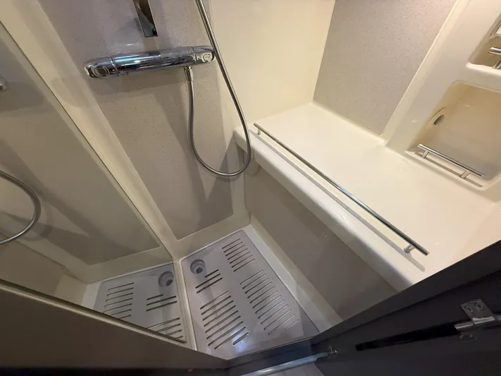 Ufo Yacht Photos Pics Shower area in 2018 Chris-Craft Launch 38 boat, featuring modern fixtures and sleek design.